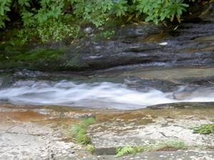 Water contniuing down that swift and thin channel.