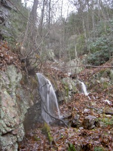 No real cave entrances I could find, the water just disappeared into a small crack in the rocks