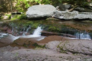 Notice the red coloring of the rocks and water.