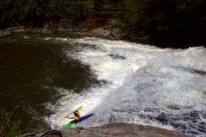 A kayaker runs Swallow Falls