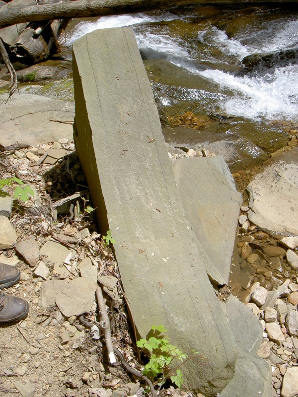 Interesting rock, those are cracks, should be possible to break this into flat even slabs.